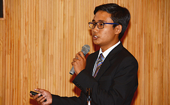 The awardee from Myanmar gives a presentation.